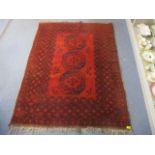 A red ground Bokhara rug