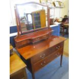 An early 20th century stained mahogany dressing table with two short and one long drawer, 61"x 42" x