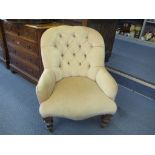 A late Victorian armchair on turned walnut legs