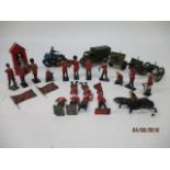 A diecast rack motorcycle and sidecar, Britains and two other cannons, a diecast military truck