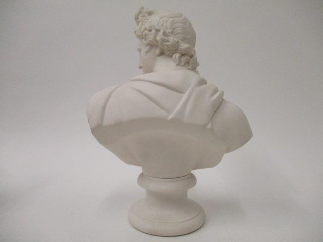 A 19th century Parian ware bust of a classical man wearing a sash, on a sockel, 11"h - Image 3 of 4