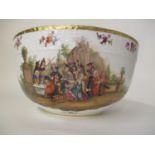 A late 19th century KPM porcelain bowl decorated with a group of men around a table in a garden