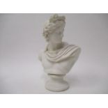 A 19th century Parian ware bust of a classical man wearing a sash, on a sockel, 11"h