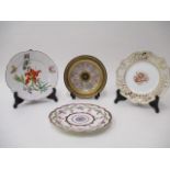 Nine Continental porcelain plates and dishes to include a Sevres plate decorated with sprigs of