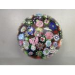 A French 19th century Clichy scrambled millefiori paperweight with signature Clichy rose cane,