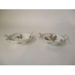 A pair of late 19th century KPM porcelain dishes with twin handles, decorated with sprigs of