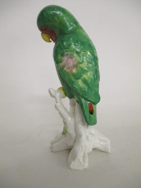 A Copeland Spode china model of a green parrot with red and pink markings and a yellow beak, perched - Image 3 of 4