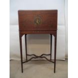 An Edwardian Sheraton revival painted mahogany chest, with a hinged, arched top enclosing a mahogany