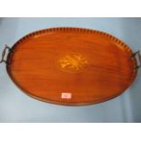 An inlaid mahogany Edwardian oval tray with galleried edge and twin handles