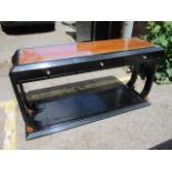 A Chinese style black lacquered console table with three small drawers