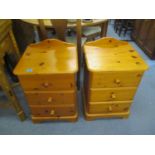 A pair of modern pine three drawer bedside cabinets