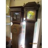 A Georgian oak cased 8 day longcase clock having a gilt dial with applied spandrels and Roman