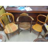 Three early 20th century chairs to include a satinwood caned seated chair, a bedroom chair and an