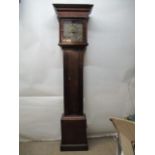 A George III longcase clock with a brass dial and silvered Arabic and Roman numeral chapter ring and