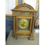 A late 19th century oak cased 8 day mantle clock, having a gilt dial with a silvered chapter ring