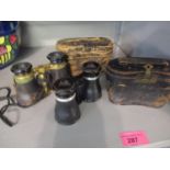 Two pairs of leather cased binoculars to include Negetti and Lemaine