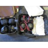 A set of four Thomas Taylor Bowls Ltd Crown Green bowls with jacket and trousers, in a suitcase,