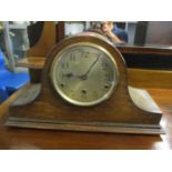 A 1930s oak cased Napoleon hat mantle clock