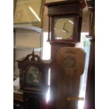 A 30 hour long case clock together with two granddaughter clock cases