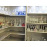 A large selection of glassware to include forty four decanters, hand blown glasses, wine glasses,