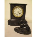 A Victorian black marble cased mantle clock and a soft metal model of a greyhound