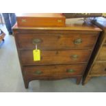 A Georgian mahogany three drawer chest of drawers, with a shaped apron, 32" h x 30"w