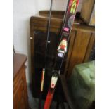 A pair of Torsion Control Course SL skis and a snooker cue