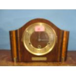 A 1930s walnut mantle clock