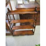 A mahogany wall hanging open shelf unit with base drawers, 35 1/2" x 27" x 6 5/8"