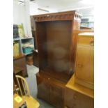 A late 20th century Reprodax yew wood open bookcase cabinet, the top with adjustable shelves over