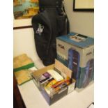 A mixed lot to include a golf bag with travel cover, picture frames, stamps and other artist related