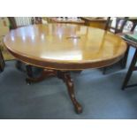 A Victorian mahogany circular topped tilt top breakfast table standing on three splayed legs 28 3/