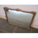 An ornate gilt wall mirror