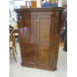 An early 19th century mahogany hanging corner cabinet with a pair of panelled doors, 50" h, 37"w