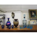 Two Venetian glass decanter sets, one with four glasses and the other six, along with a Greek vase