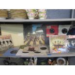 A collection of Beatles records and mixed gramophone records