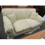 A Circa 1900's three-seater sofa with later upholstery standing on square tapering legs