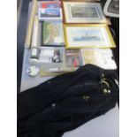 A selection of QE2 memorabilia to include a small model in a case, a jacket, a DVD, a booklet,