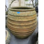 A large terracotta garden planter, 25 1/4" h x 22 3/4"w