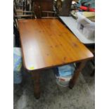 A modern pine kitchen table on turned legs 30"h x 48"w