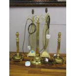 Five table lamps to include a pair of cream and gold painted metal lamps, a pair of brass reeded