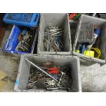 A selection of tools to include spanners, drills and other items