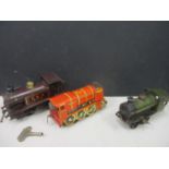 A vintage red tin plate clockwork Britannia locomotive, a vintage green Hornby clockwork