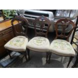 Three 19th century walnut tapestry seated chairs standing on fluted legs