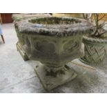 A stoneware octagonal garden planter, raised on a square base, 23 1/2" h x 24 1/2"w