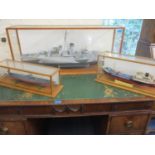 A cased model boat of the Flower Class Corvette HMCS Showberry 15" x 36" x 9", together with two