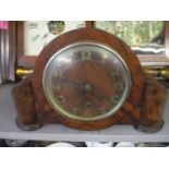 A mid 20th century walnut clock with a Westminster chime