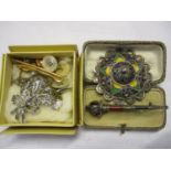 A mixed lot of costume jewellery to include a Scottish brooch