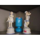 A pair of French coloured bisque figurines, together with a retro style turquoise coloured table