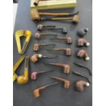 A quantity of vintage pipes to include Peterson's Churchwarden and a silver banded Crown pipe